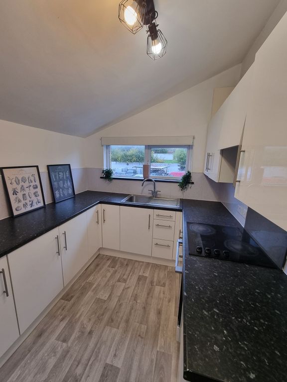 Property photo 2 of 5 A Modern, Well-Maintained Kitchen Featuring White ...