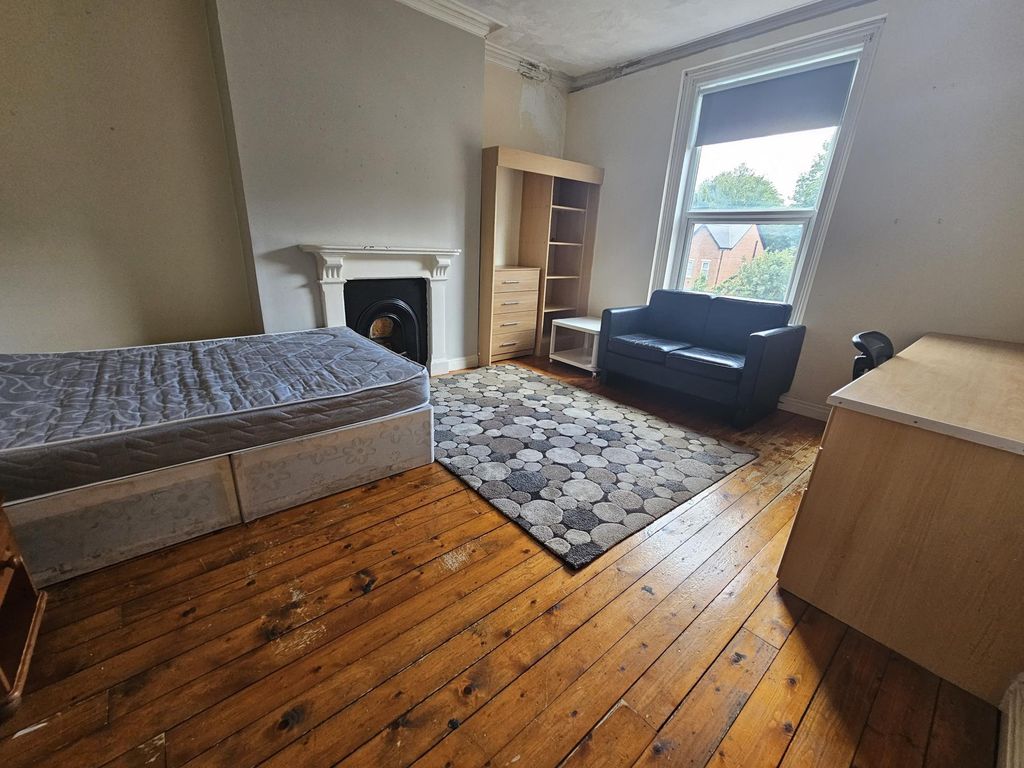 Property photo 3 of 16 A Bright And Cozy Bedroom Featuring A Single Bed, ...