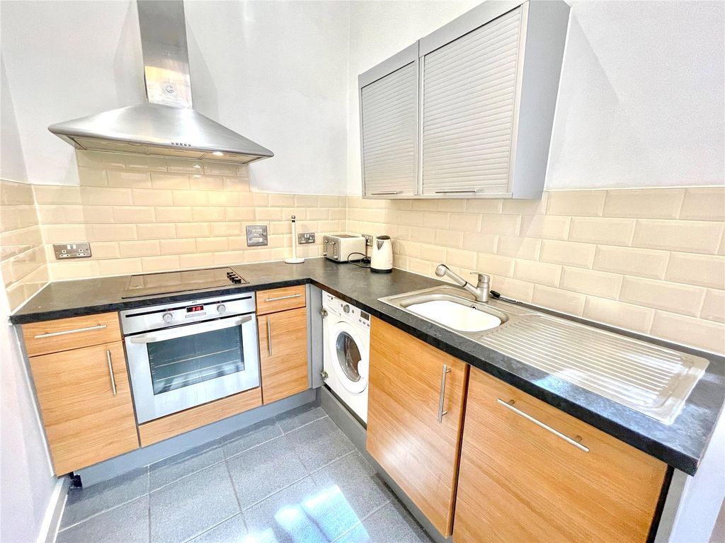 Property photo 3 of 8 Kitchen