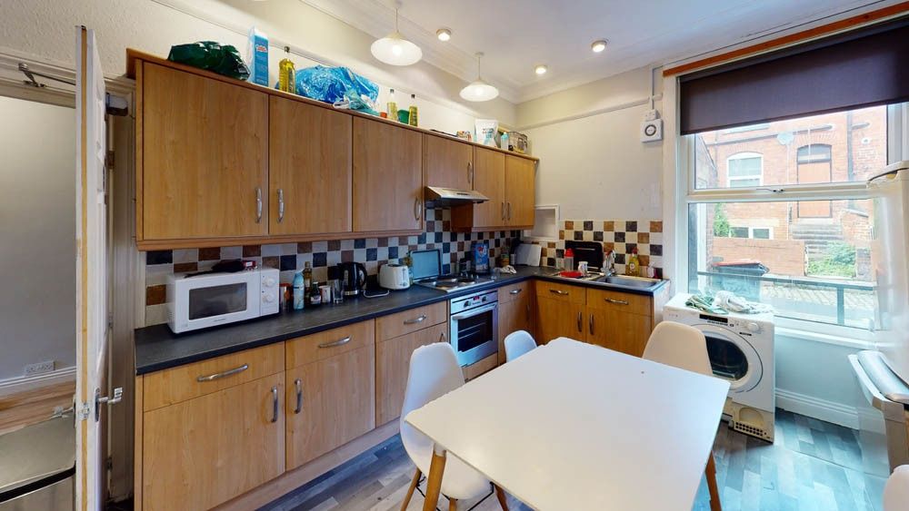 Property photo 3 of 9 Bright And Well-Equipped Kitchen Featuring Wooden ...