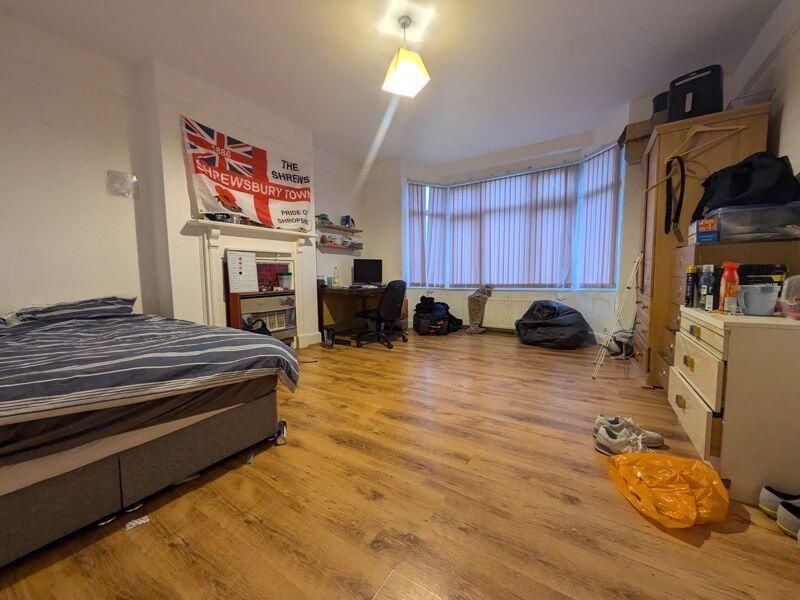 Property photo 1 of 13 Spacious, Well-Lit Master Bedroom With Wooden Floo...