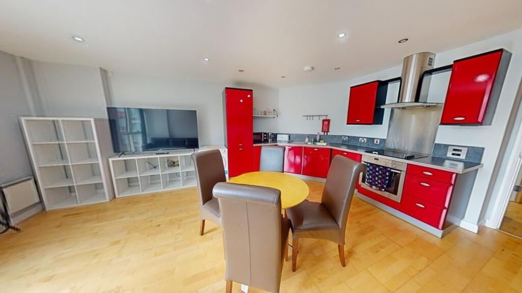 Property photo 3 of 6 Bright And Modern Kitchen With Vibrant Red Cabinet...