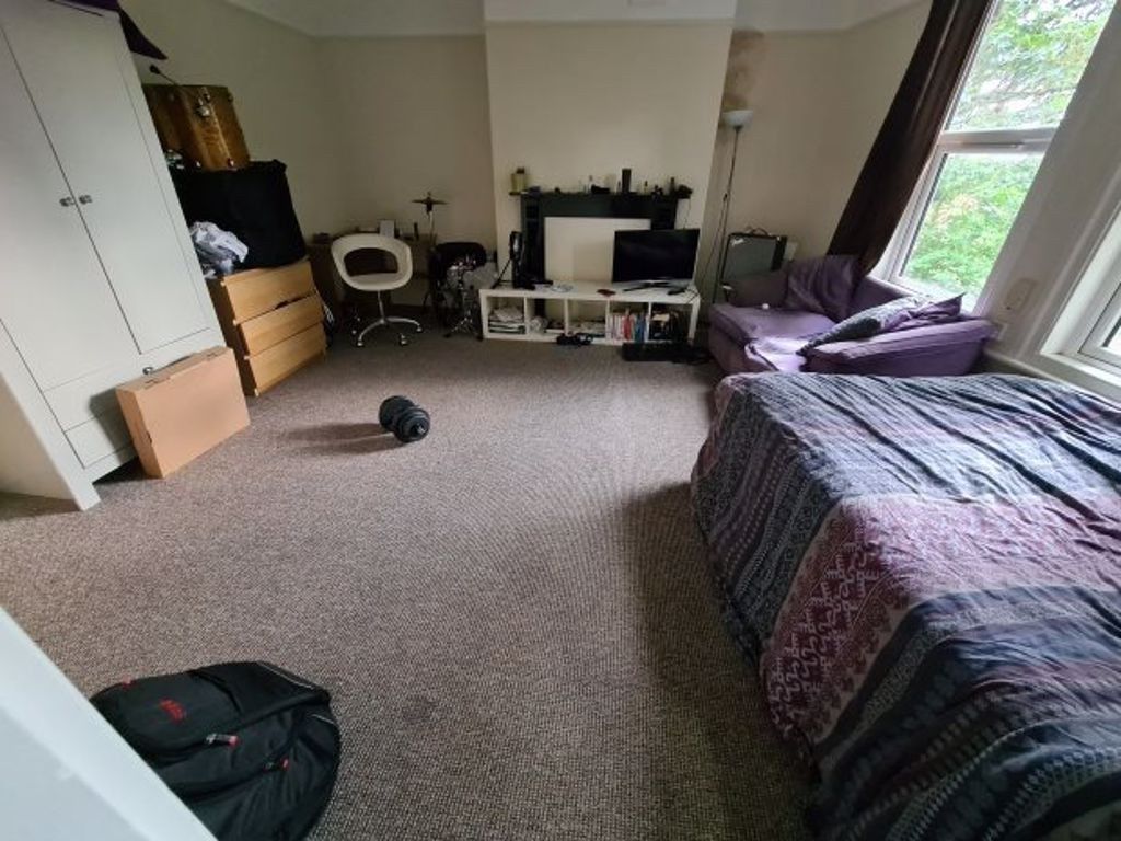 Property photo 2 of 6 A Spacious And Well-Lit Bedroom Featuring A Large ...