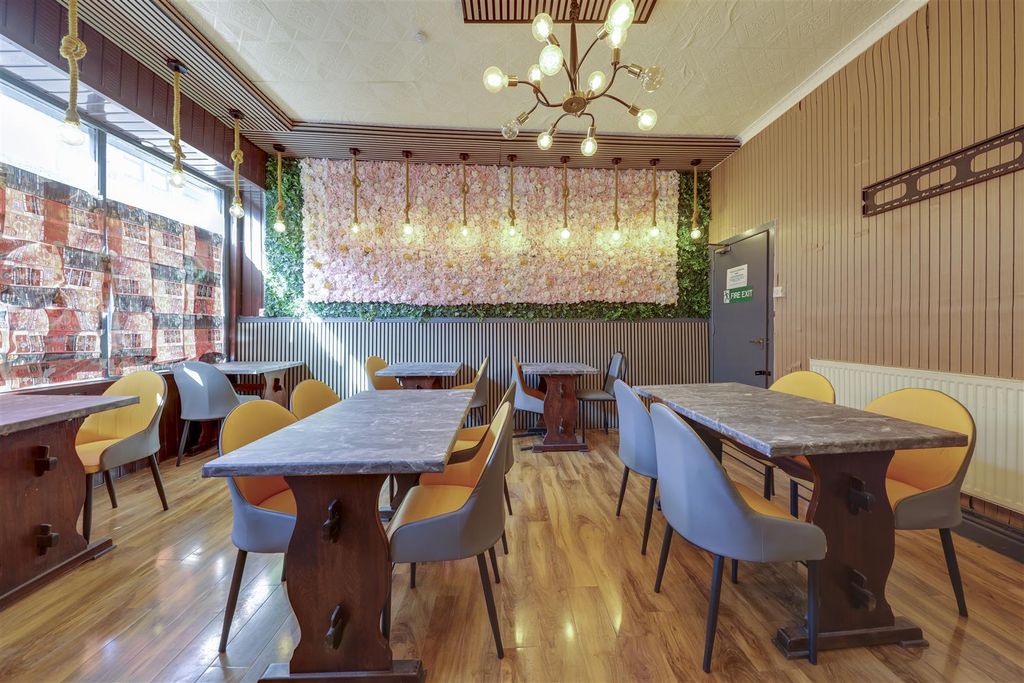 Property photo 3 of 12 Bar / Restaurant Area Alt