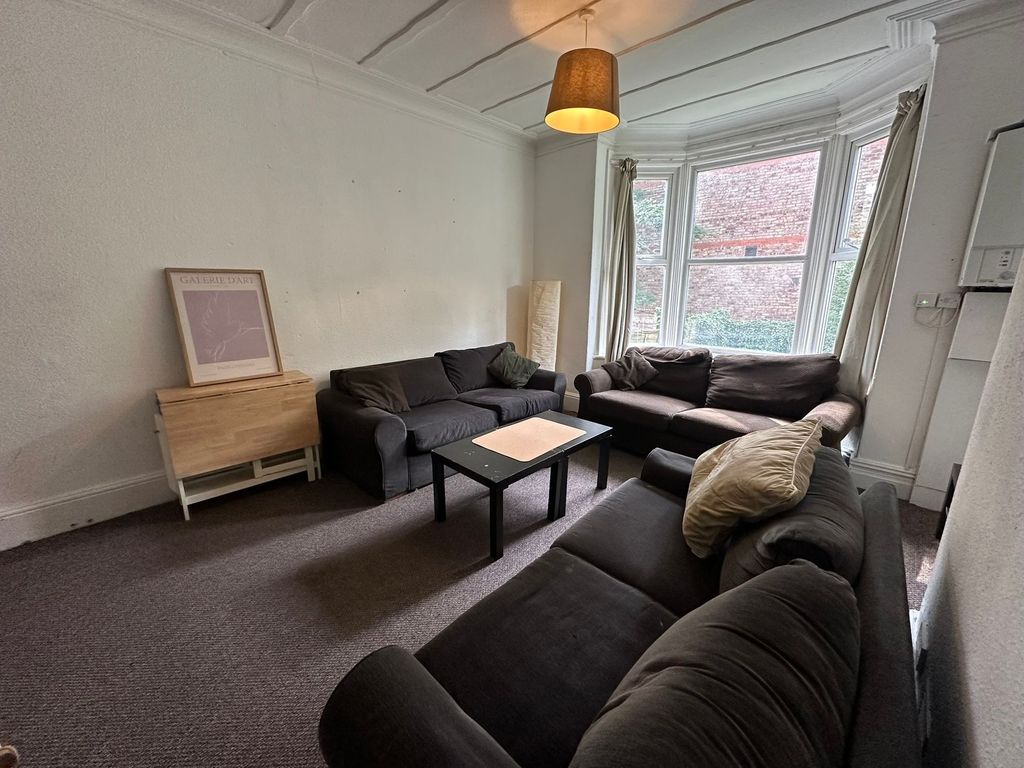 Property photo 3 of 34 A Spacious, Well-Lit Living Room Featuring A Large...