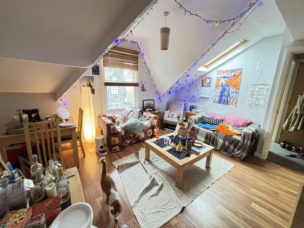 Property photo 3 of 10 A Bright And Inviting Living Room With Large Windo...