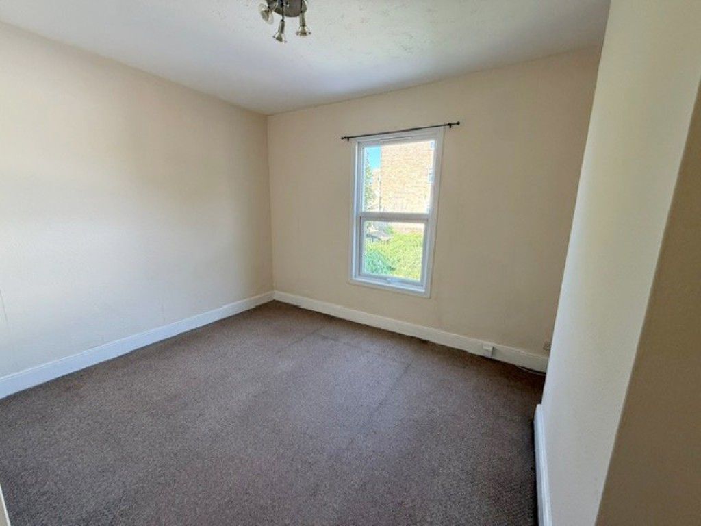 Property photo 3 of 10 Living Room With Radiator And Window To The Rear