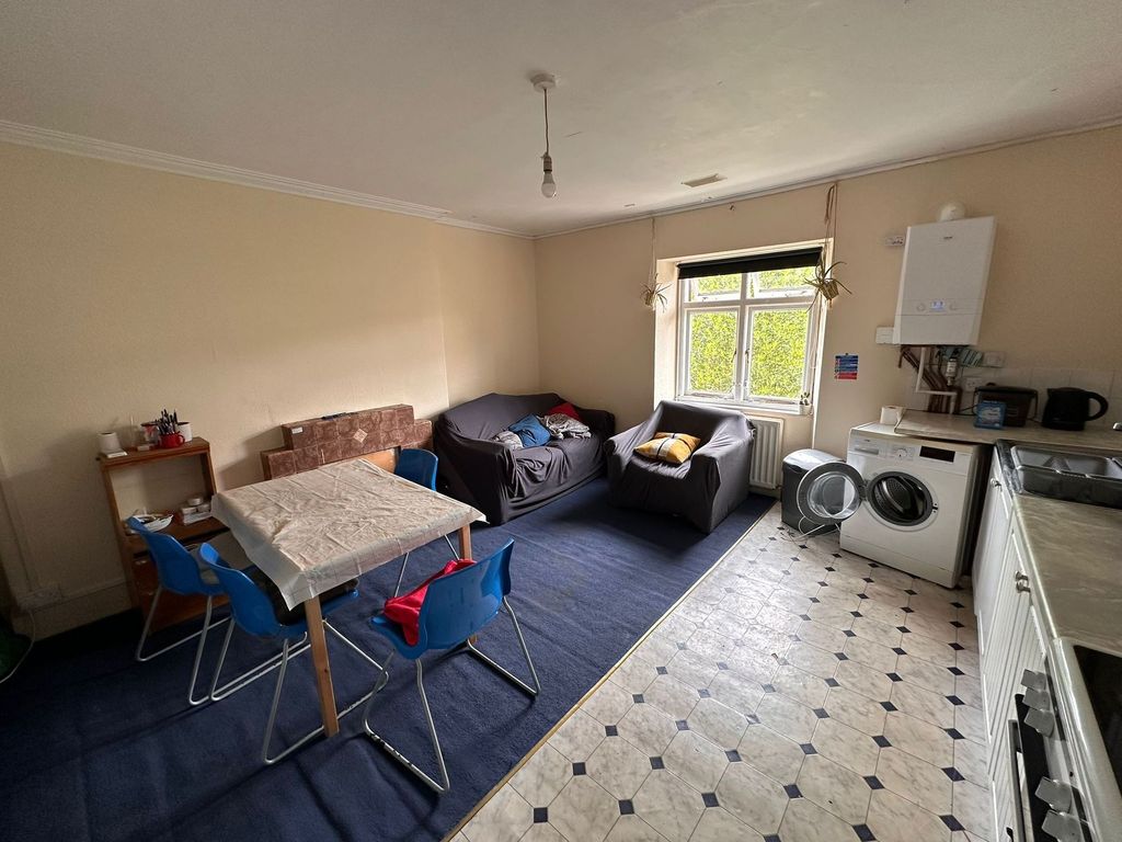 Property photo 2 of 18 A Cozy Living Room Featuring A Small Seating Area ...
