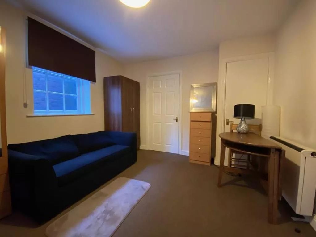 Property photo 3 of 7 Bedroom/Living Room