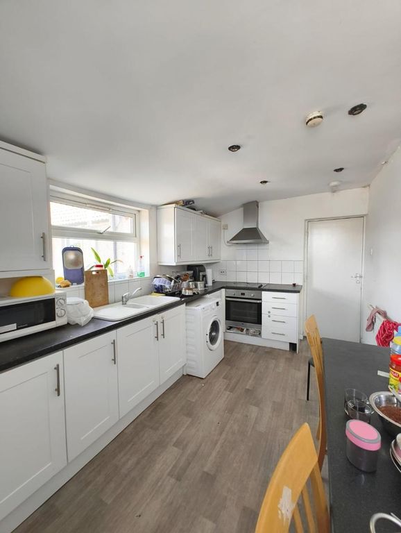 Property photo 3 of 13 Bright And Functional Kitchen Featuring Ample Coun...