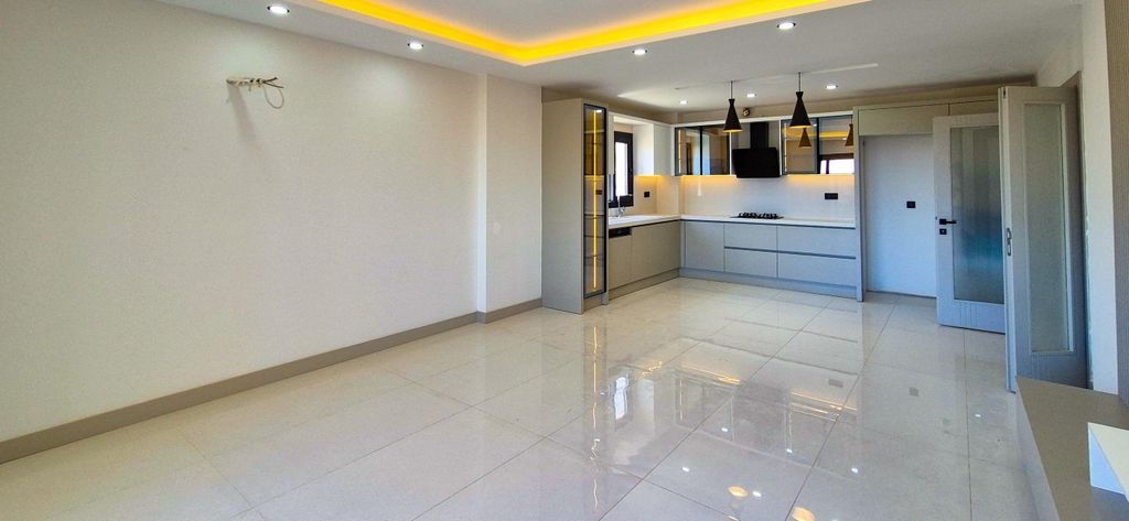 Property photo 3 of 19 Newly Built Apartments In Kusadasi With A Shared Pool For Sale - Open-Plan Living Space