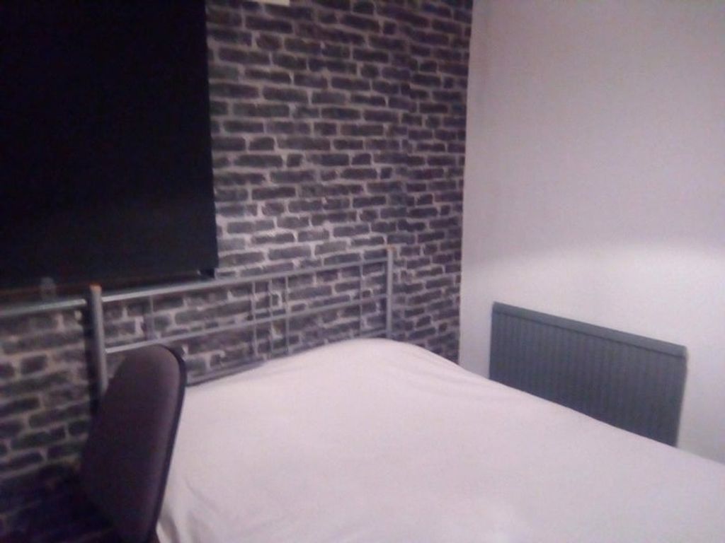 Property photo 3 of 5 Cozy Double Bedroom Featuring Stylish Exposed Bric...