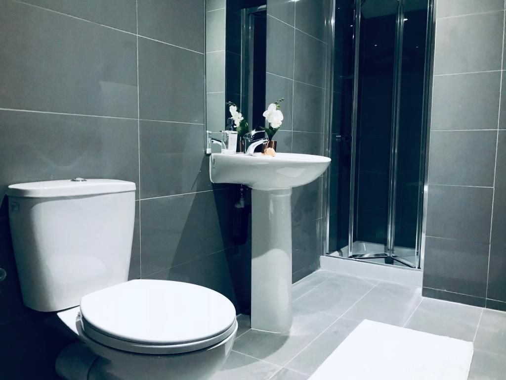 Property photo 3 of 12 Modern, Clean Bathroom Suite Featuring A Large Sho...