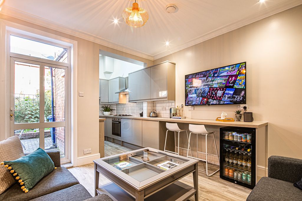 Property photo 3 of 24 A Modern And Welcoming Living Room Featuring A Com...