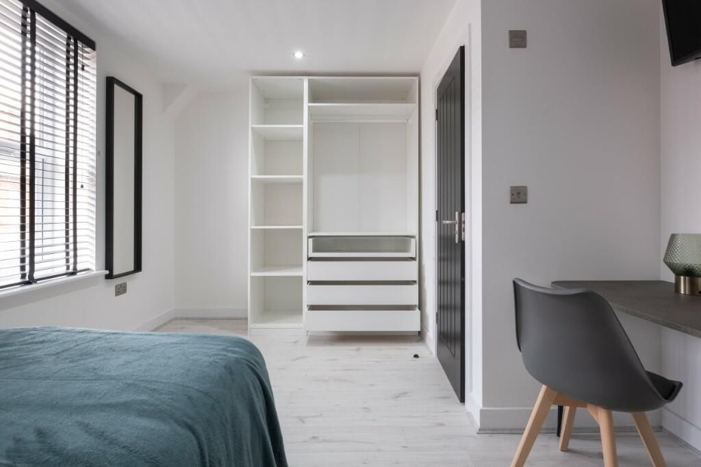 Property photo 2 of 15 Bright And Modern Master Bedroom Featuring A Comfo...