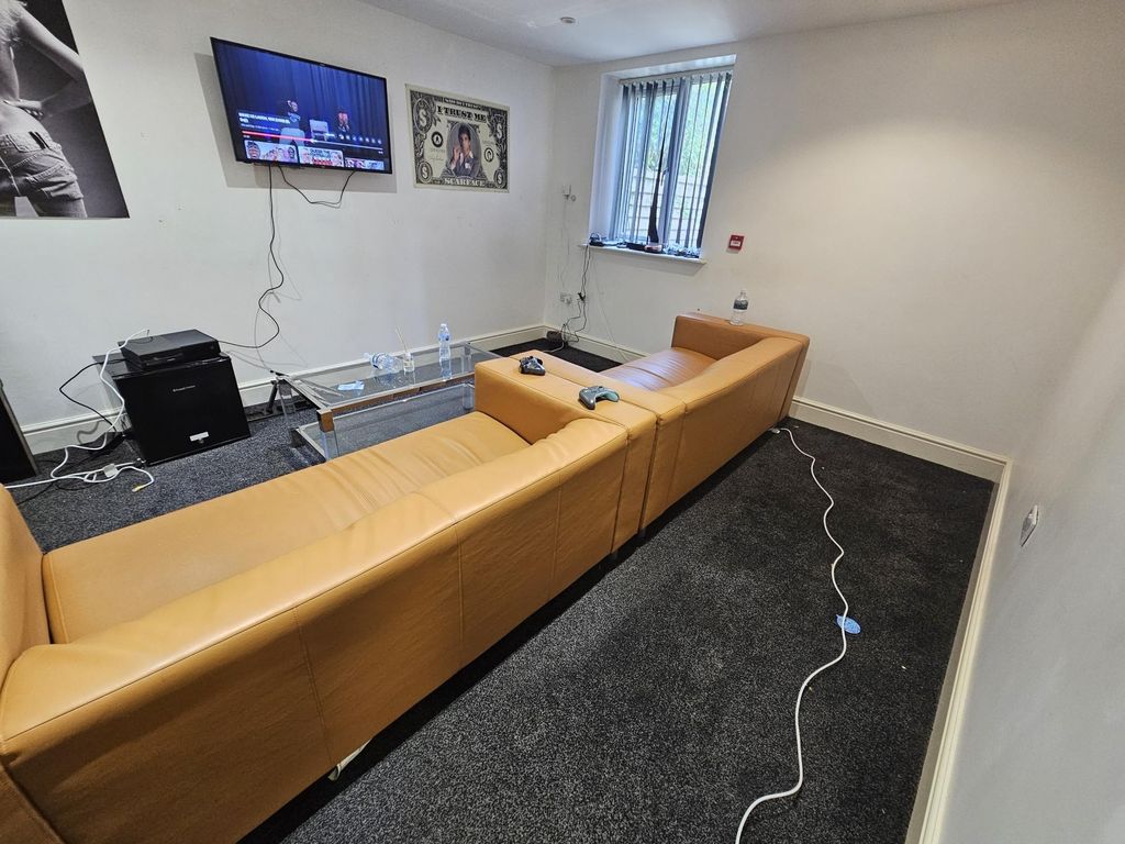 Property photo 2 of 10 A Contemporary Living Room Featuring A Large Tan S...
