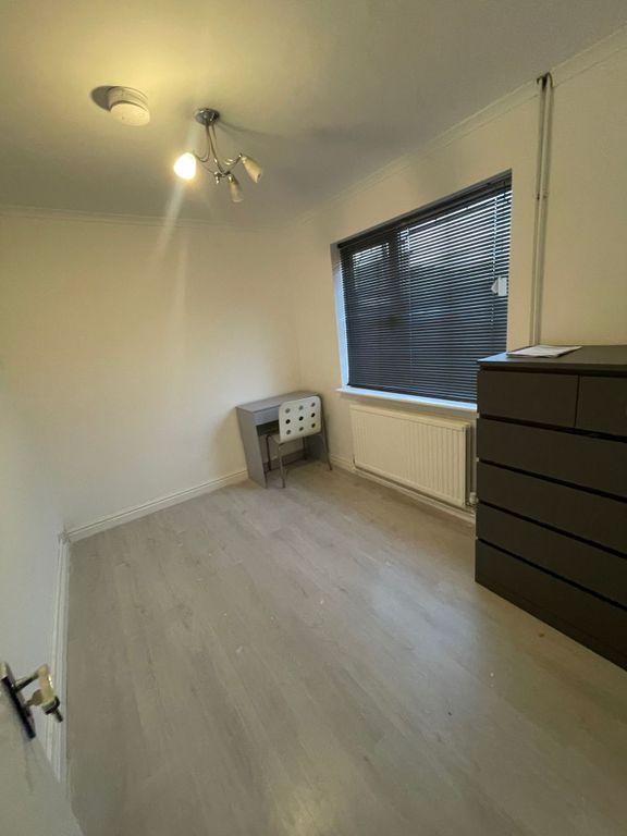 Property photo 2 of 12 A Minimalist Single Bedroom Featuring Light Wood F...