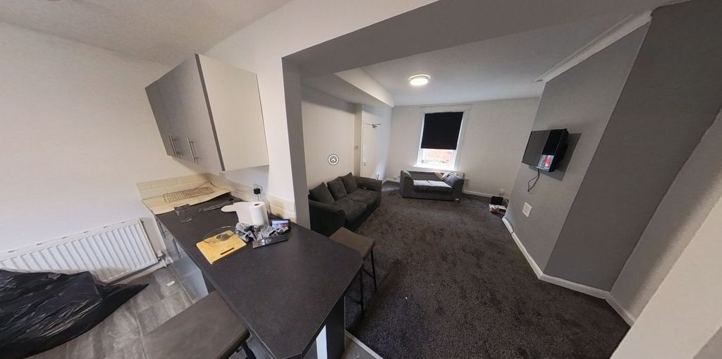 Property photo 1 of 5 A Spacious And Well-Lit Living Room With Contempor...