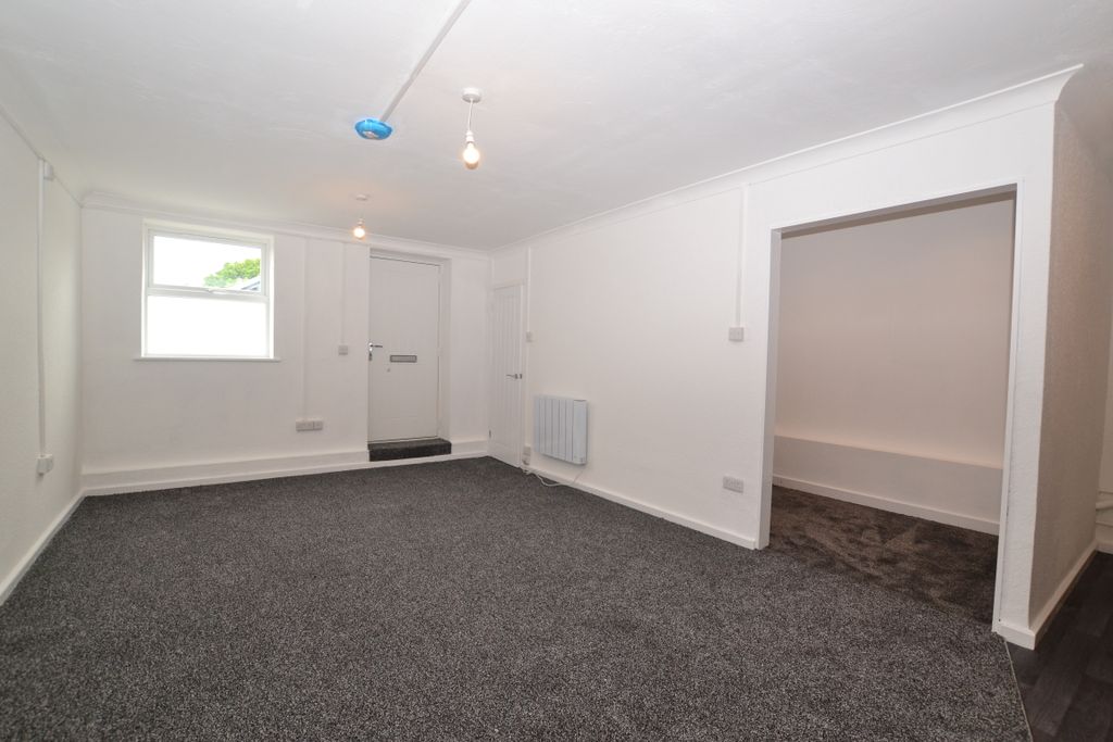 Property photo 1 of 9 Living Area With Storage Space