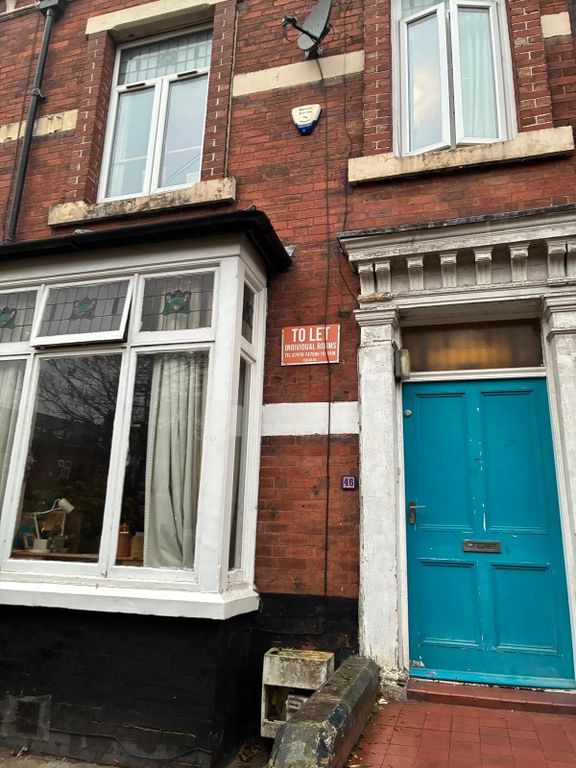 Property photo 2 of 4 Charming Red Brick House With Vibrant Blue Door...