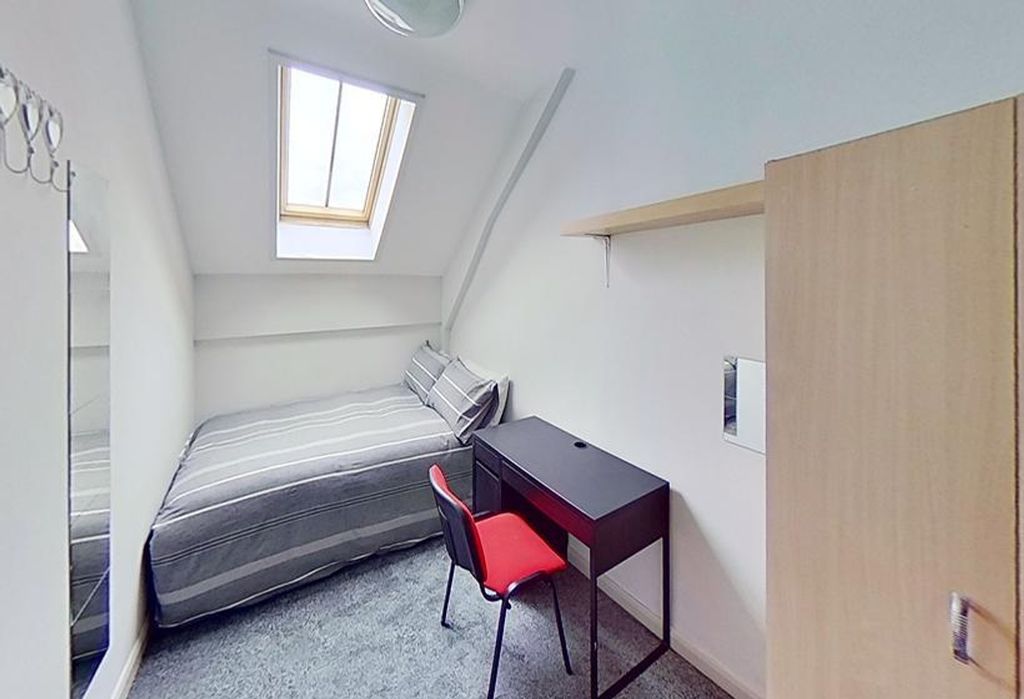 Property photo 3 of 6 This Charming Double Bedroom Features A Cozy Bed A...