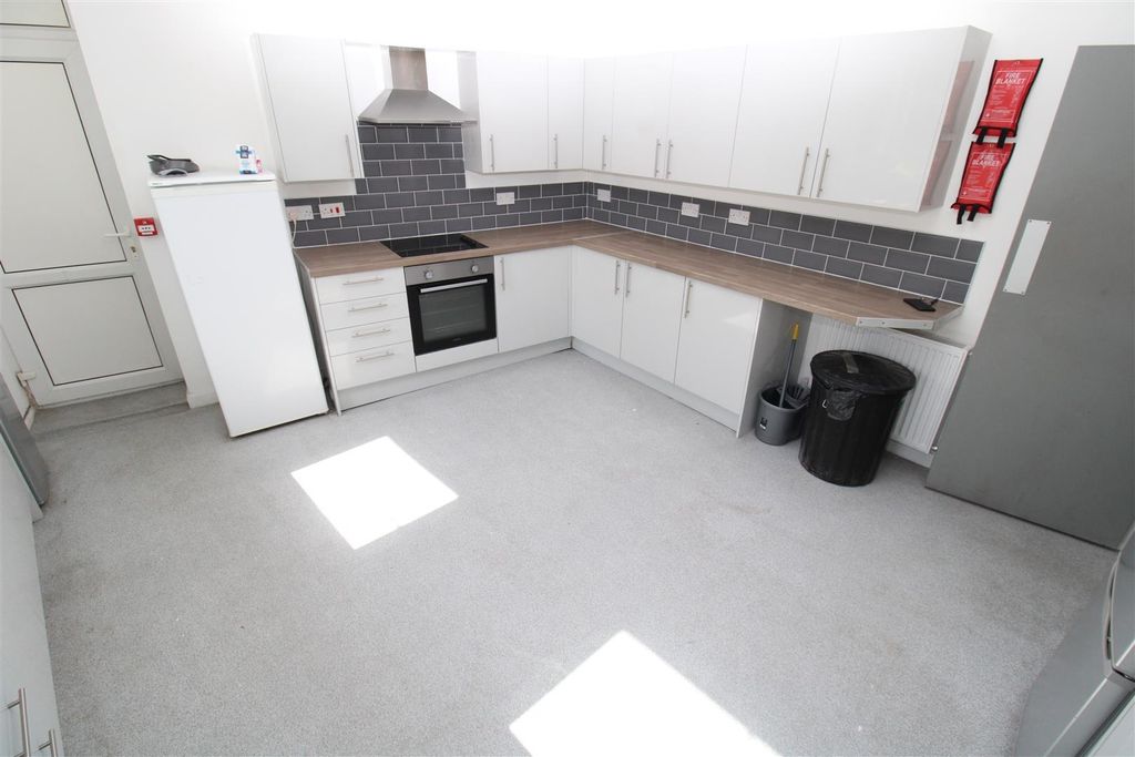 Property photo 3 of 10 Modern Kitchen With Ample Storage And Workspace...