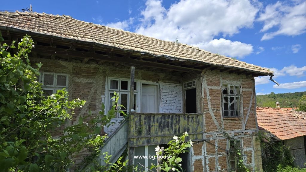 Property photo 3 of 42 Close-Up View Of Two-Storey Brick House With External Wooden Stairs And Broken Windows