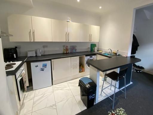 Property photo 2 of 15 A Modern, Bright Kitchen Area Featuring White Cabi...