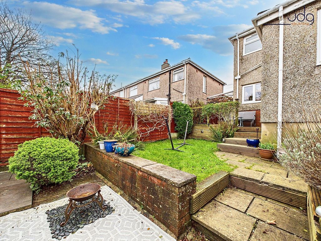 Property photo 2 of 12 Tiered Garden With A Mixture Of Flags, Decking And Lawn.