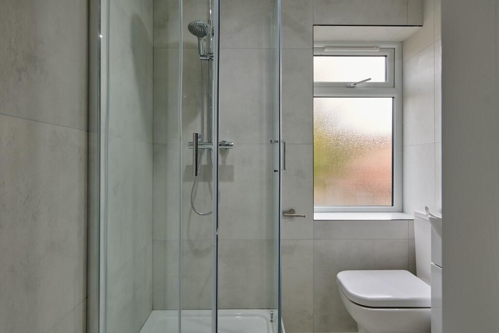Property photo 2 of 9 Clean And Modern Bathroom Featuring A Shower Cubic...