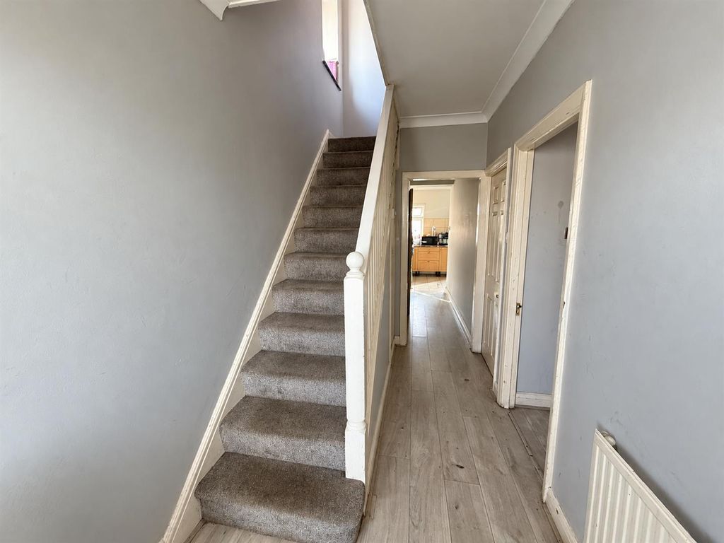 Property photo 2 of 6 Grey Hallway With Staircase And Kitchen View.Png