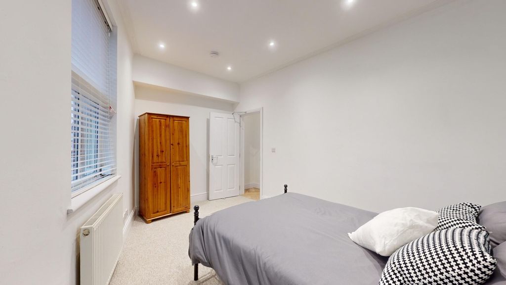 Property photo 3 of 15 A Spacious And Inviting Double Bedroom Featuring A...