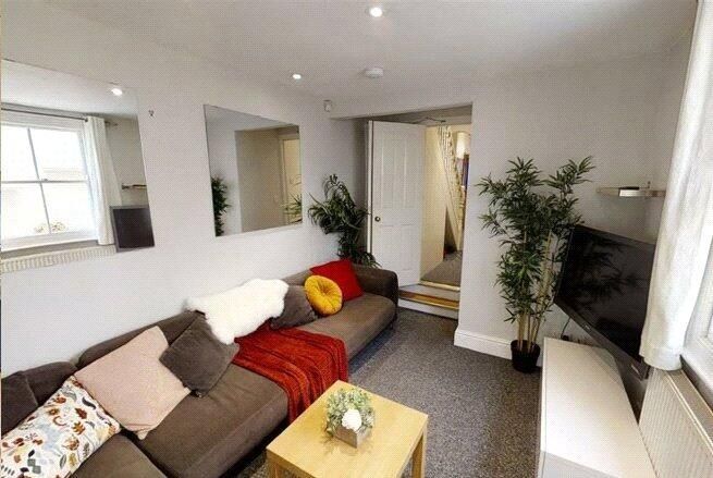 Property photo 2 of 4 A Cozy And Inviting Living Room Featuring A Comfor...
