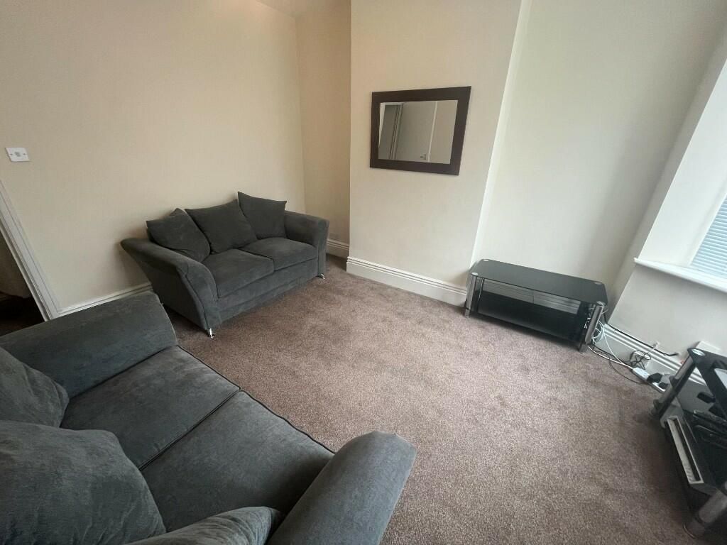 Property photo 3 of 10 A Cozy Living Room Featuring Two Comfortable Sofas...