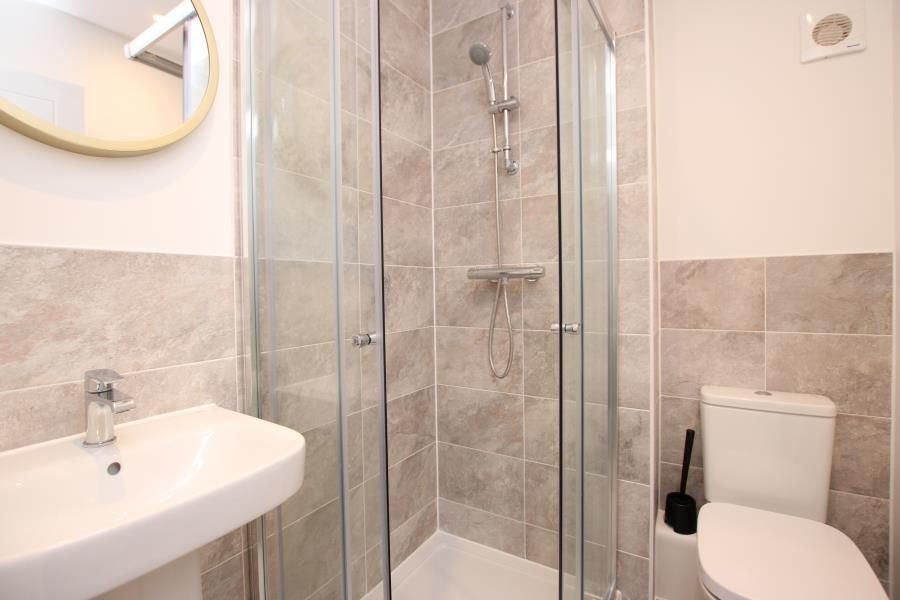 Property photo 3 of 14 Bright, Modern Bathroom Featuring A Glass-Enclosed...