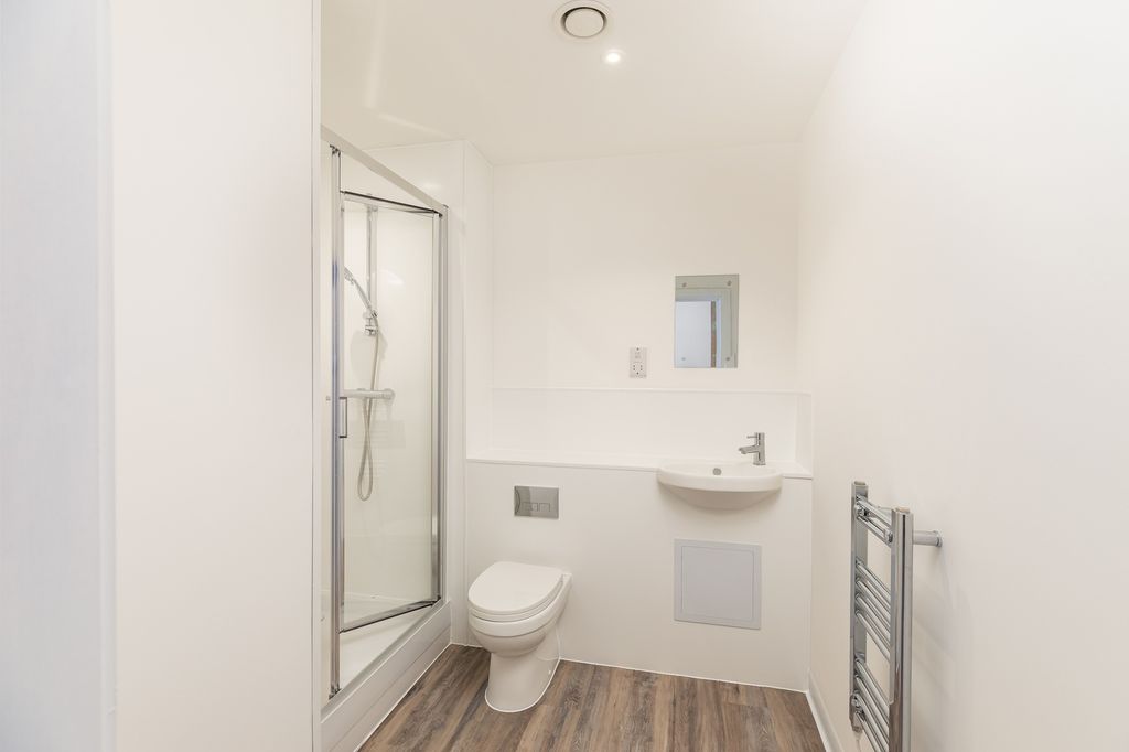 Property photo 3 of 3 A Modern And Pristine Bathroom Featuring A Spaciou...