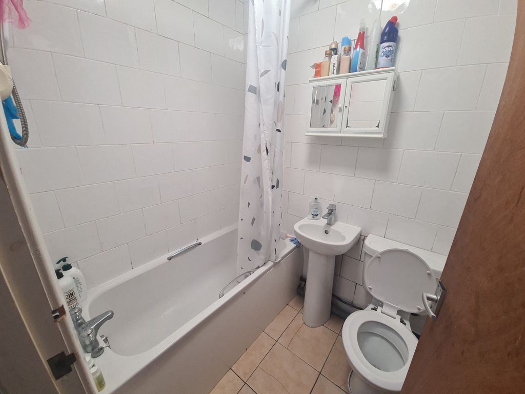 Property photo 2 of 3 Bright And Clean Bathroom Featuring A Full-Sized B...