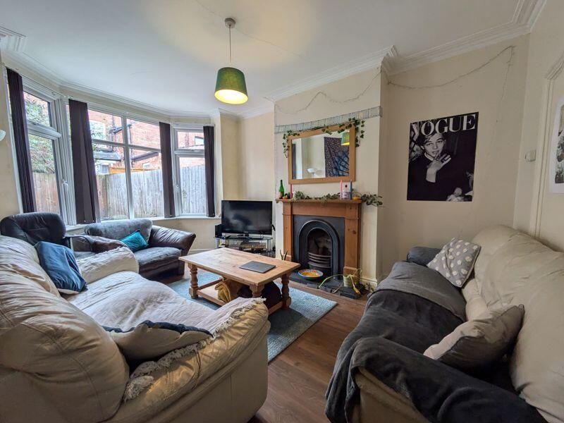 Property photo 2 of 13 A Bright And Welcoming Living Room Featuring Comfo...