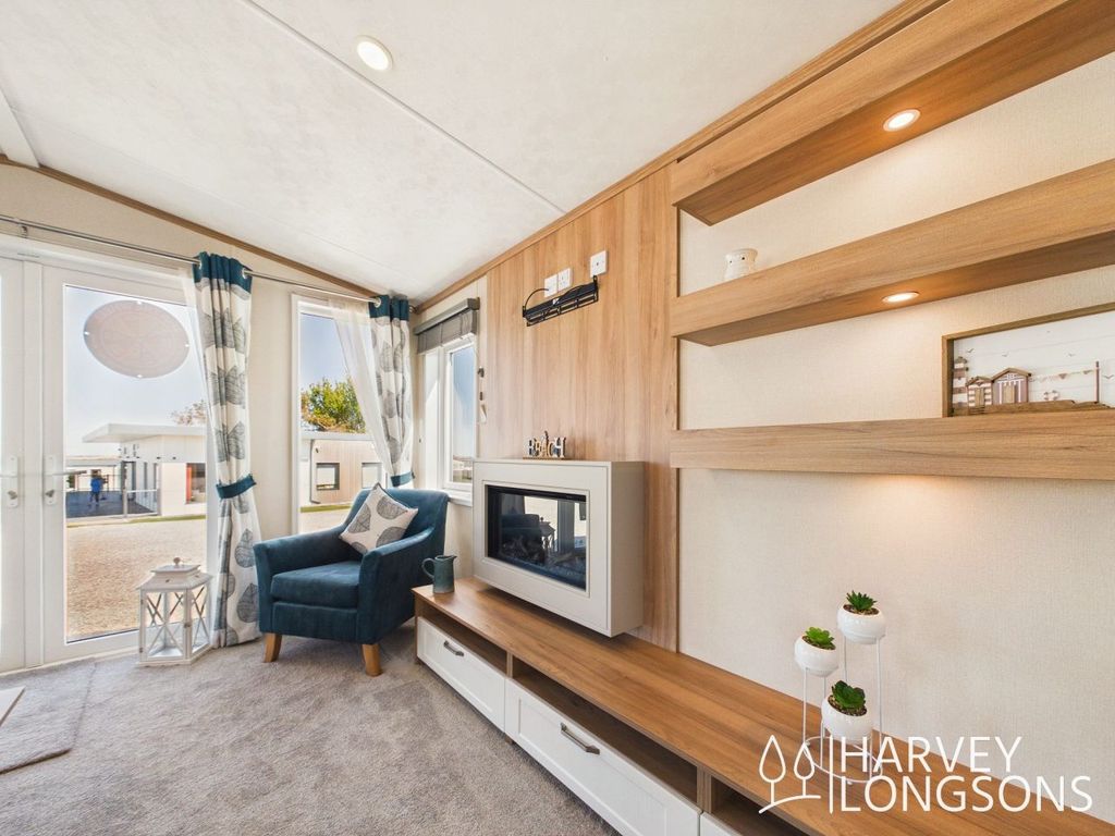 Property photo 2 of 17 Modern Caravan Living Room With Built In Fireplace And Shelving