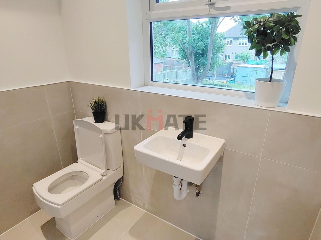 Property photo 1 of 7 A Bright And Clean Bathroom Featuring A Modern Toi...
