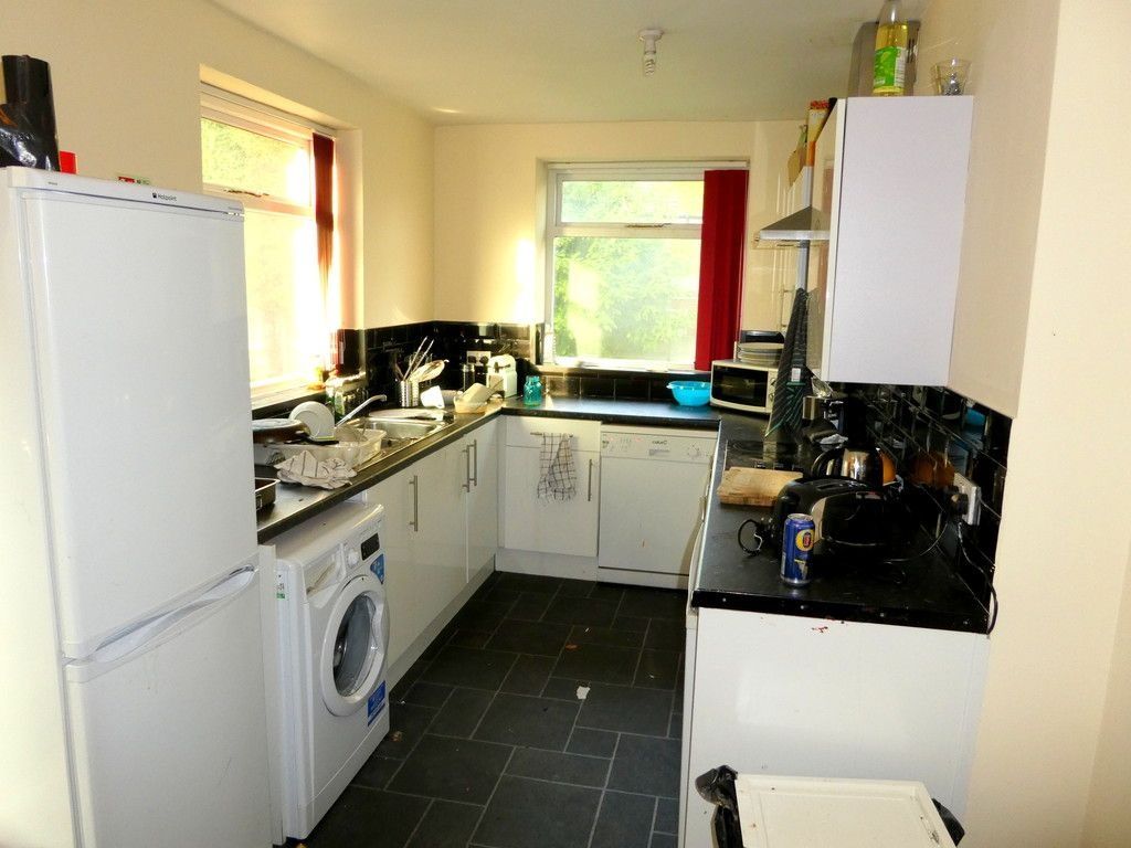 Property photo 3 of 12 Bright, Well-Equipped Kitchen With Modern Black Co...