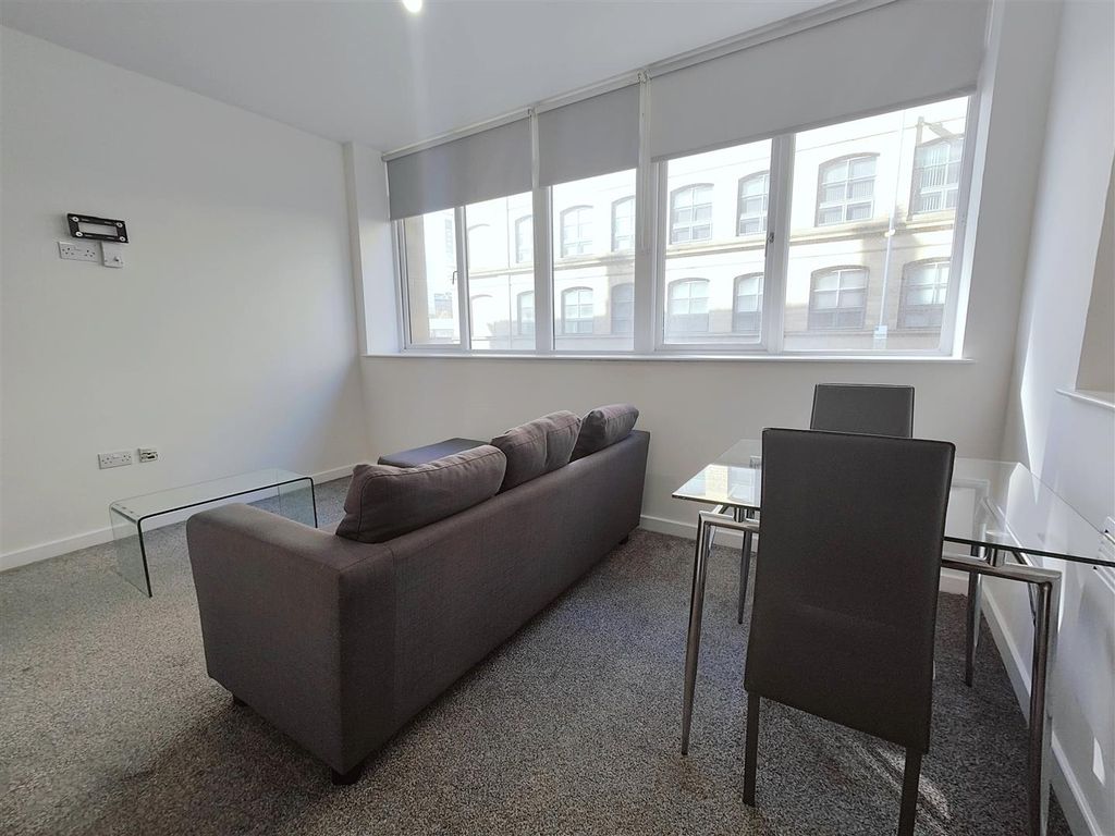 Property photo 2 of 9 Living Room Angle Two