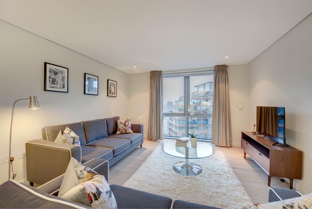 Property photo 2 of 12 A Modern Living Room Featuring A Spacious Layout W...