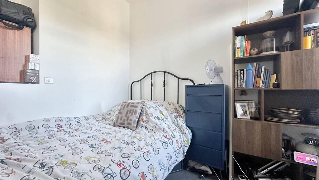 Property photo 3 of 6 A Cozy Single Bedroom Featuring A Single Bed, A Wa...