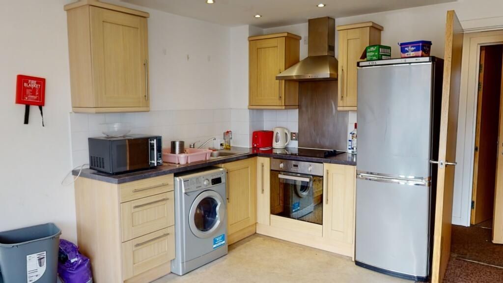 Property photo 1 of 6 Bright And Functional Kitchen Equipped With Modern...