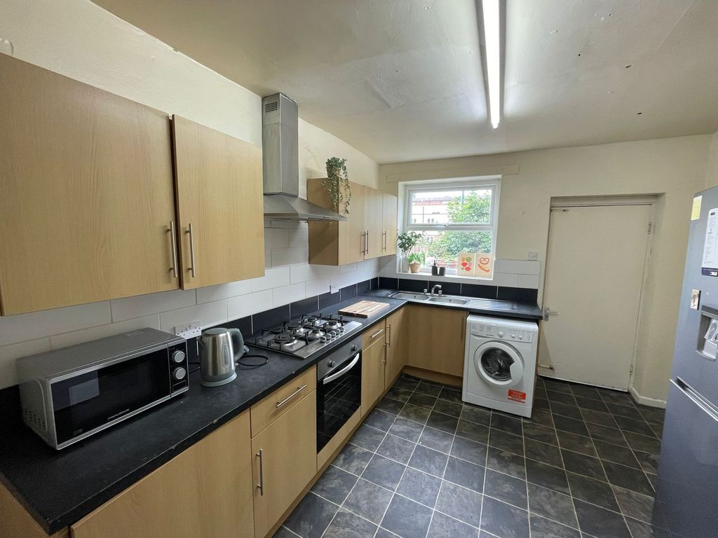 Property photo 2 of 17 Modern And Functional Kitchen Area With Wooden Cab...
