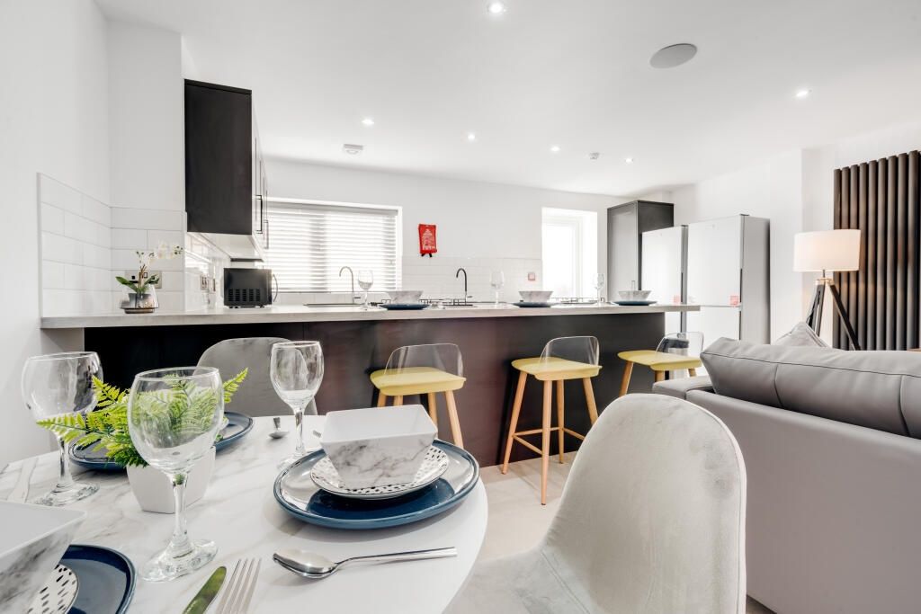 Property photo 1 of 12 A Modern, Well-Lit Living Room With Stylish Furnit...