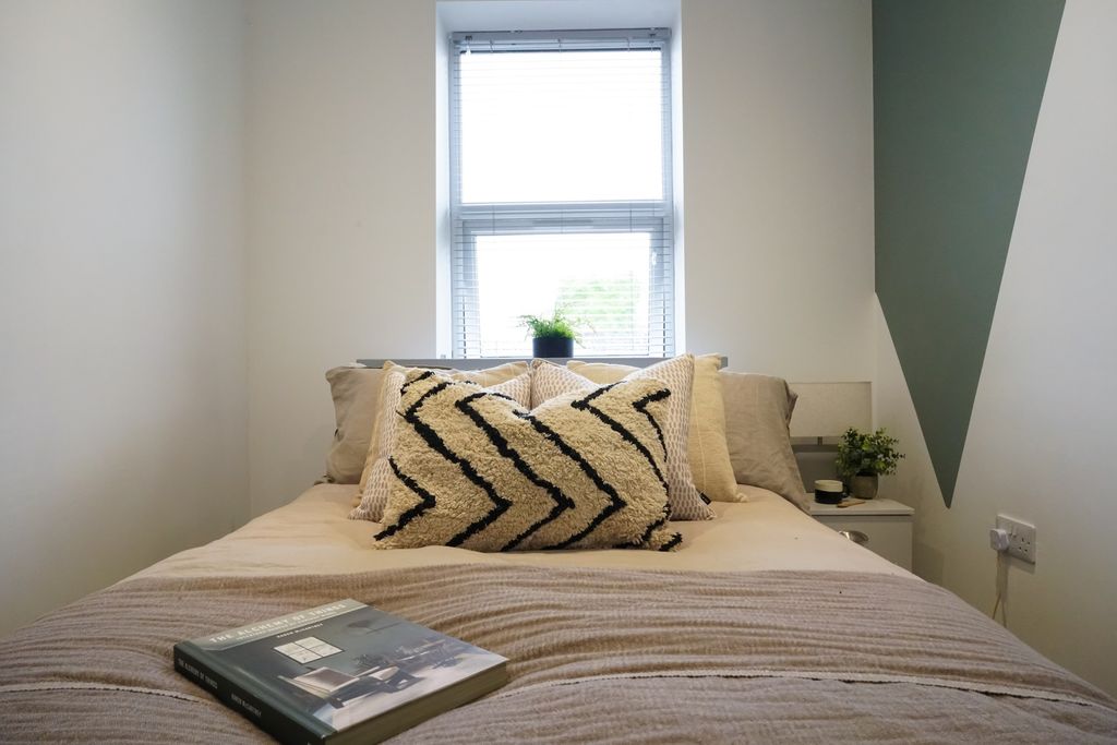 Property photo 3 of 11 A Bright And Inviting Master Bedroom Featuring A d...