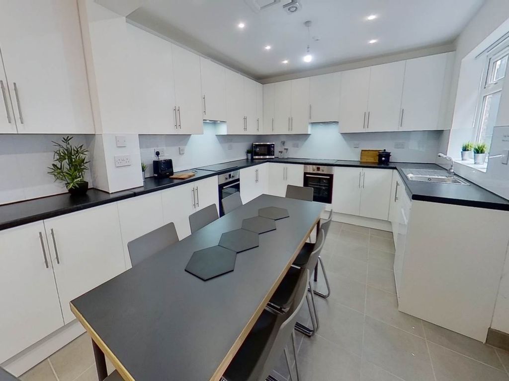 Property photo 3 of 7 Modern And Spacious Kitchen With Ample Storage, cl...