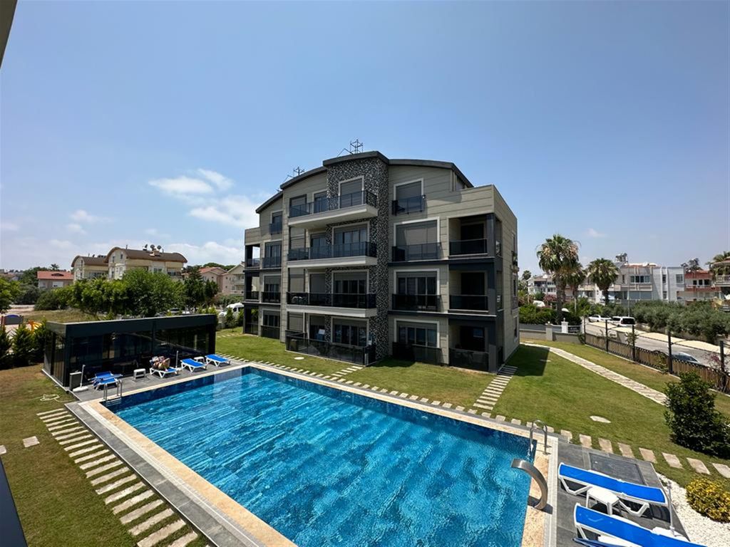 Property photo 2 of 10 Belek Garden Apartment In Antalya For Sale - Main View Of The Complex And Communal Pool